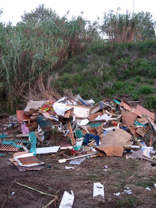 Medium close-up of the large pile of debris in which people once lived