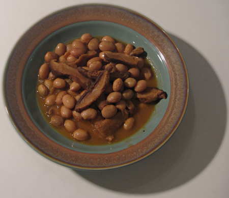 Dish of borlotti soup with dried shiitake mushrooms, very brown and very delicious